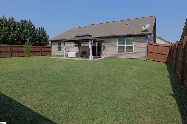 502 E Heatherstone Ln, Roebuck, SC 29376 - back of property with a lawn, a patio, a gazebo, and a fenced backyard