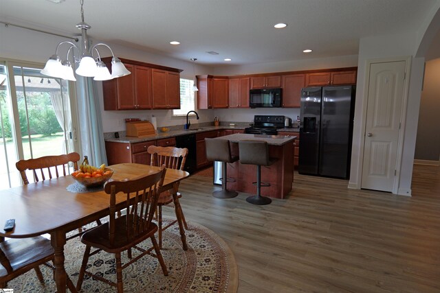 502 E Heatherstone Ln, Roebuck, SC 29376 - dining room featuring recessed lighting, wood finished floors, and a notable chandelier