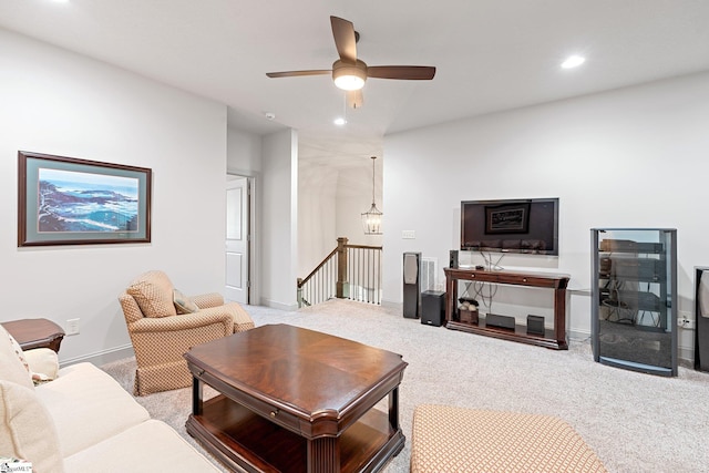 living area featuring recessed lighting, baseboards, a ceiling fan, and carpet