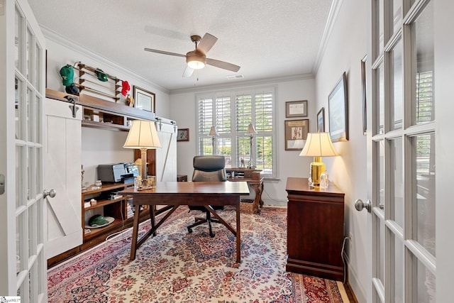 office area with french doors, crown molding, ceiling fan, and visible vents