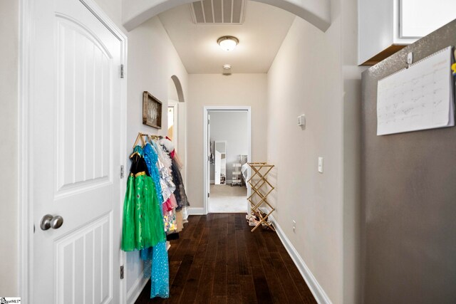 180 Bur Oak Dr, Taylors, SC 29687 - corridor with arched walkways, baseboards, dark wood-type flooring, and visible vents