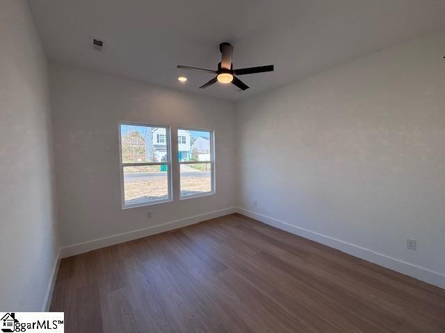 550 Vault Way, Roebuck, SC 29376 - spare room with visible vents, wood finished floors, baseboards, recessed lighting, and a ceiling fan