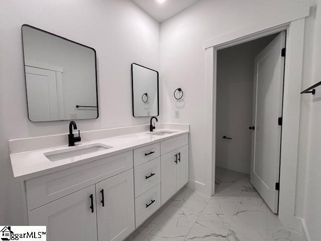 550 Vault Way, Roebuck, SC 29376 - full bath featuring double vanity, baseboards, a sink, and marble finish floor