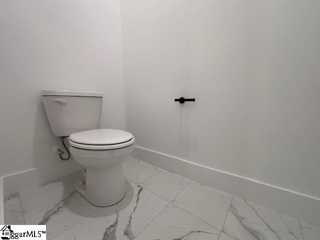 550 Vault Way, Roebuck, SC 29376 - bathroom featuring toilet, baseboards, and marble finish floor