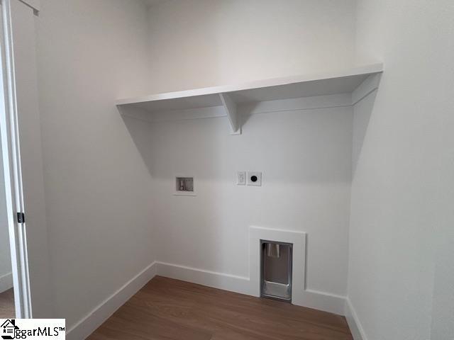 550 Vault Way, Roebuck, SC 29376 - laundry room with laundry area, washer hookup, baseboards, electric dryer hookup, and wood finished floors