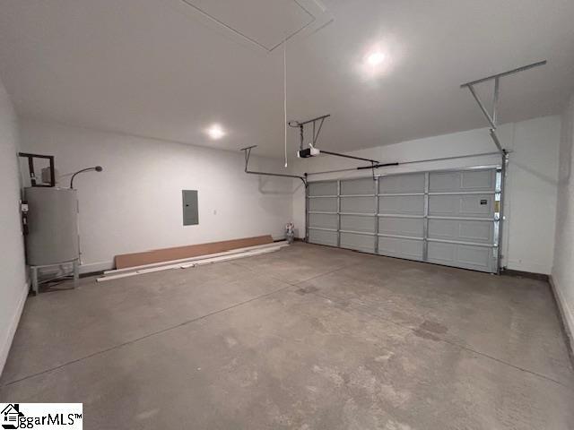 550 Vault Way, Roebuck, SC 29376 - garage featuring baseboards, a garage door opener, water heater, and electric panel