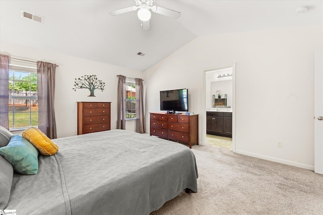 bedroom with visible vents, baseboards, vaulted ceiling, and light colored carpet