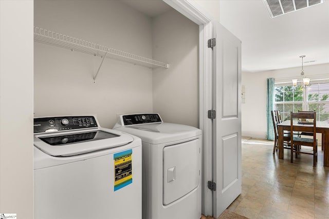 laundry area with separate washer and dryer, laundry area, and visible vents