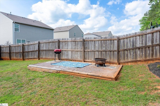 view of storm shelter with a fenced backyard and a yard