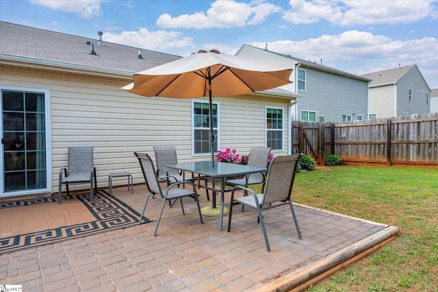 view of patio / terrace featuring fence and outdoor dining area