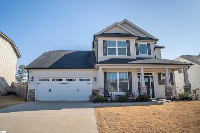 920 Ravenfield Dr, Duncan, SC 29334 - craftsman house with a porch, a garage, driveway, and stone siding