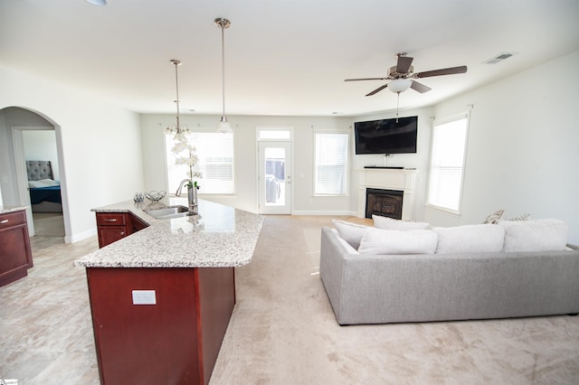 920 Ravenfield Dr, Duncan, SC 29334 - living room with a ceiling fan, visible vents, arched walkways, a fireplace, and baseboards