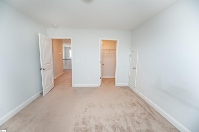 920 Ravenfield Dr, Duncan, SC 29334 - unfurnished bedroom featuring baseboards, a walk in closet, carpet, and a closet