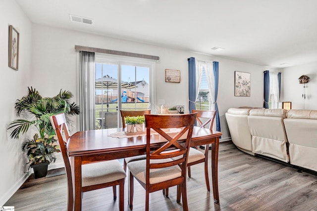 124 Highland Station Dr, Clinton, SC 29325 - dining area with light wood-style flooring and baseboards