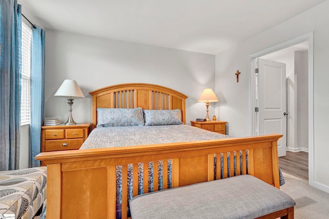 124 Highland Station Dr, Clinton, SC 29325 - bedroom with multiple windows, baseboards, and light carpet