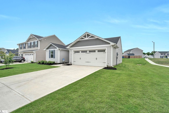 124 Highland Station Dr, Clinton, SC 29325 - view of front of home featuring board and batten siding, driveway, and an attached garage