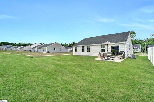 124 Highland Station Dr, Clinton, SC 29325 - rear view of house featuring a patio area, a lawn, central AC unit, and roof with shingles