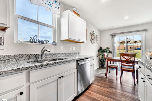 124 Highland Station Dr, Clinton, SC 29325 - kitchen with dishwasher, a sink, wood finished floors, white cabinetry, and light stone countertops