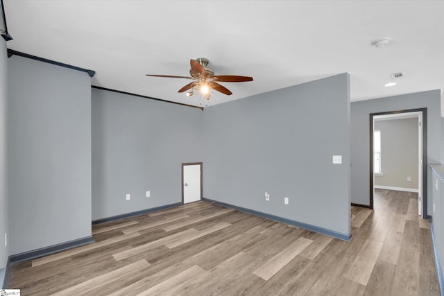 empty room featuring a ceiling fan, baseboards, recessed lighting, and light wood-style floors