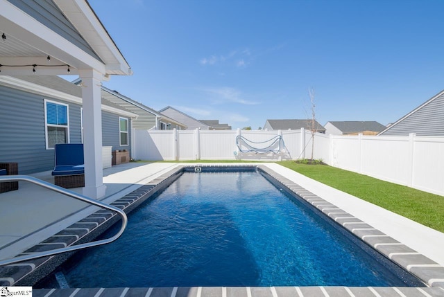 view of swimming pool with a fenced backyard, a fenced in pool, and a patio