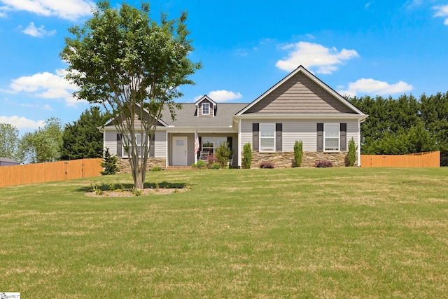 327 Terra Plains Dr, Greer, SC 29651 - craftsman-style home with fence, stone siding, and a front lawn