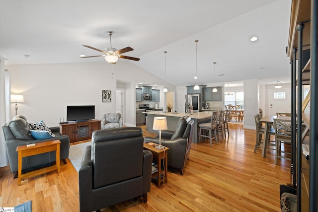 327 Terra Plains Dr, Greer, SC 29651 - living room with light wood-style floors, a ceiling fan, and vaulted ceiling