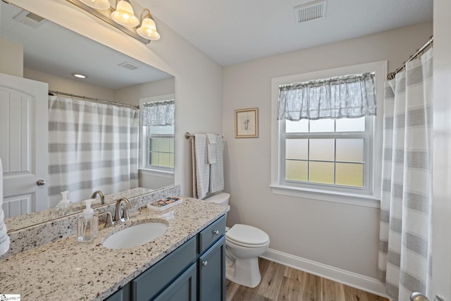 327 Terra Plains Dr, Greer, SC 29651 - full bath featuring visible vents, baseboards, plenty of natural light, and wood finished floors