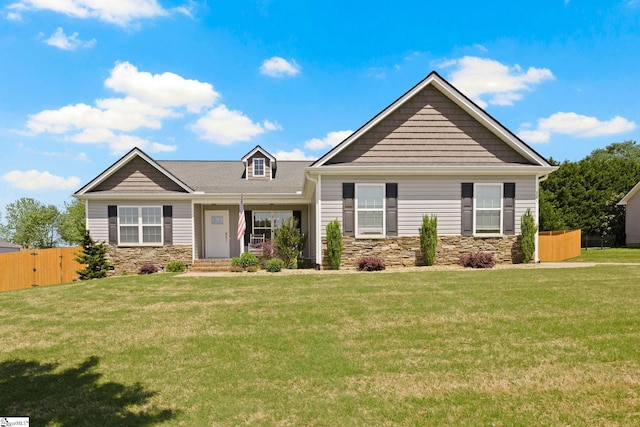 327 Terra Plains Dr, Greer, SC 29651 - craftsman-style house with a front lawn, fence, and stone siding