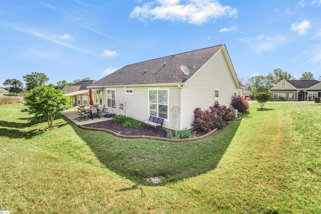 127 Alberta Cir, Piedmont, SC 29673 - back of property with a lawn, a patio, and roof with shingles