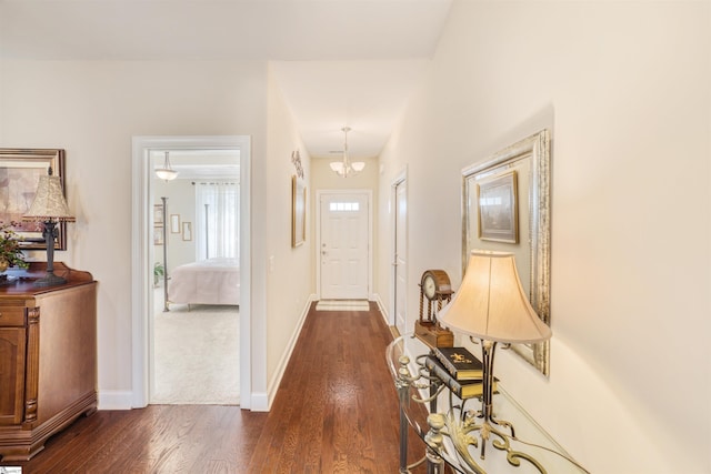 127 Alberta Cir, Piedmont, SC 29673 - foyer entrance featuring a notable chandelier, dark wood finished floors, and baseboards