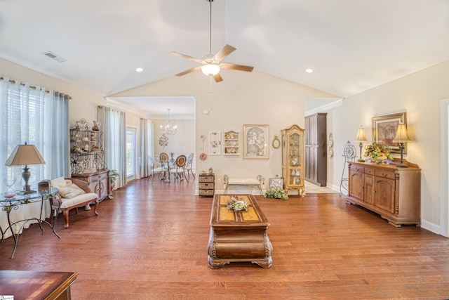 127 Alberta Cir, Piedmont, SC 29673 - living area with visible vents, lofted ceiling, wood finished floors, and ceiling fan with notable chandelier