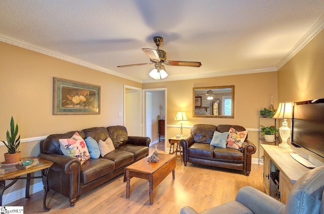 living room featuring crown molding, a ceiling fan, and wood finished floors