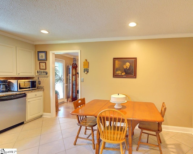 dining room featuring recessed lighting, ornamental molding, a textured ceiling, and light tile patterned flooring