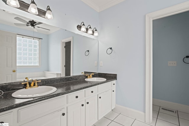 full bathroom with a sink, tile patterned floors, crown molding, and visible vents