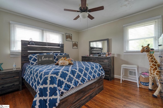 bedroom with crown molding, baseboards, ceiling fan, and wood finished floors
