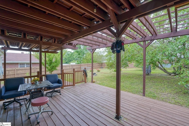 wooden deck with a lawn, a pergola, and a fenced backyard