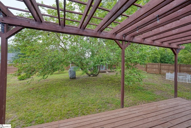 deck with a yard, a pergola, and a fenced backyard