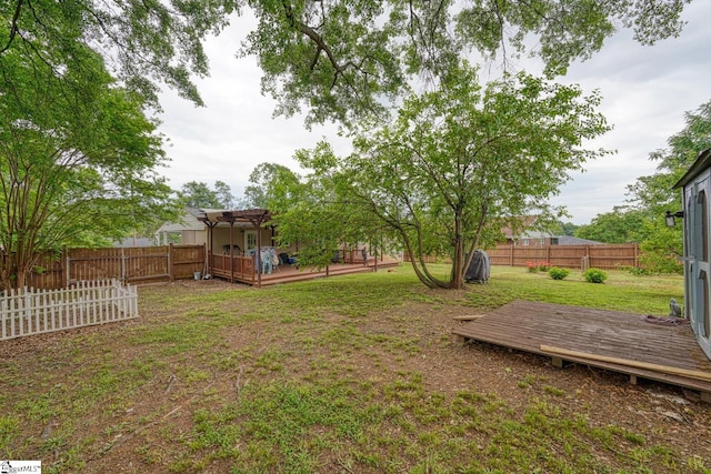 view of yard featuring a fenced backyard, a wooden deck, and a pergola