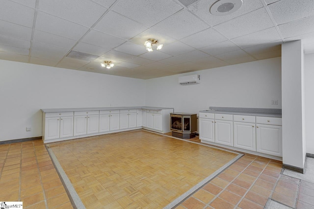 118 Pine Ln, Simpsonville, SC 29681 - interior space with baseboards, a wall mounted air conditioner, and a paneled ceiling