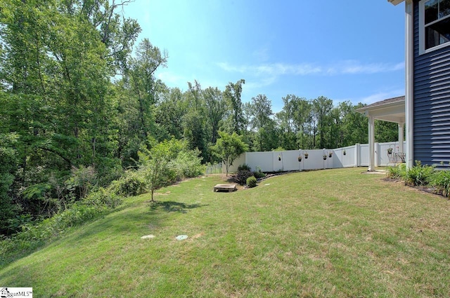 view of yard with a fenced backyard