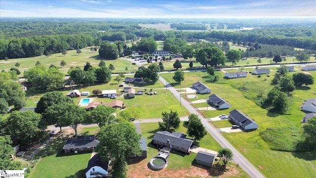 drone / aerial view featuring a view of trees