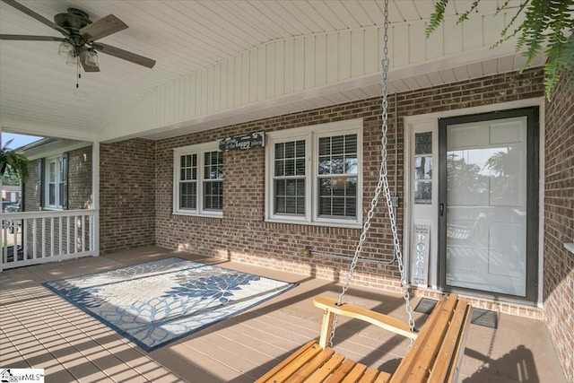 wooden deck featuring ceiling fan