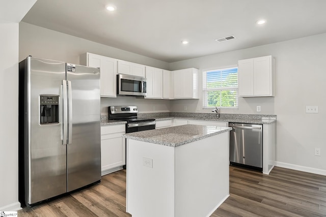 kitchen featuring visible vents, white cabinetry, dark wood-type flooring, and stainless steel appliances