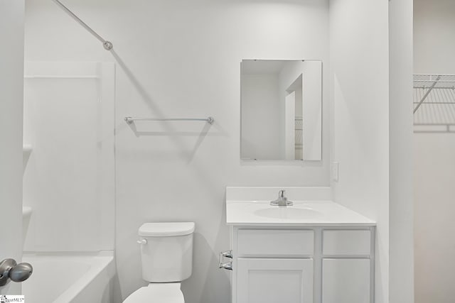 bathroom with toilet, bathtub / shower combination, and vanity