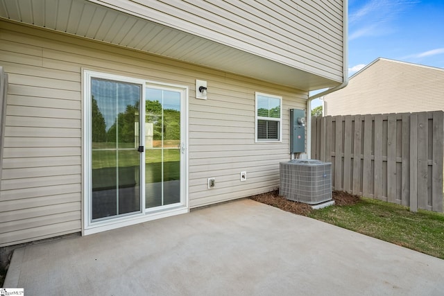 view of patio / terrace featuring fence and cooling unit