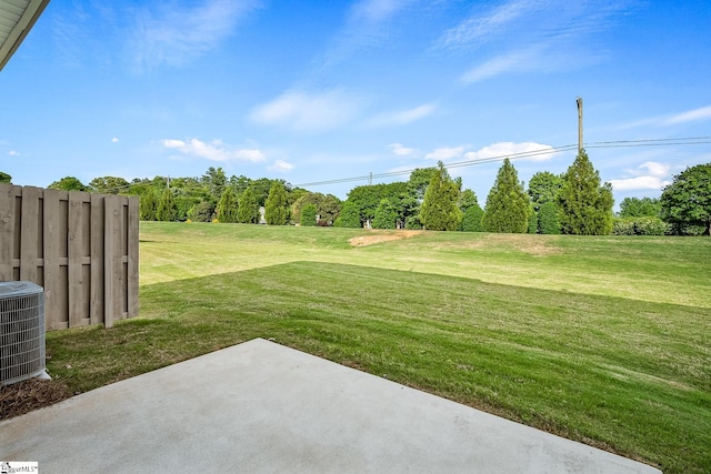 view of yard featuring a patio and central AC unit