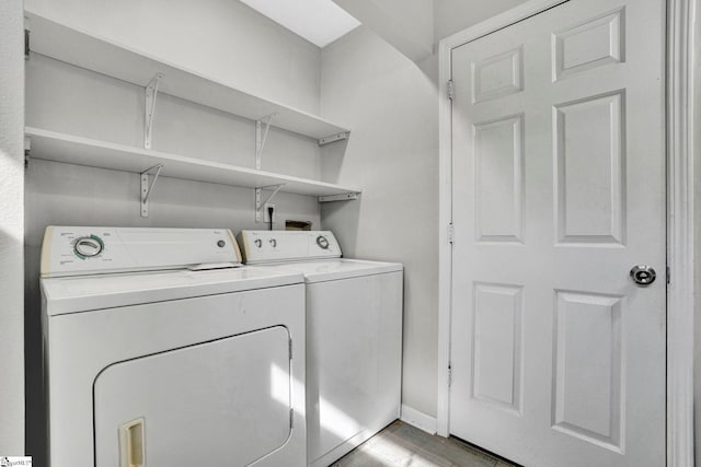 232 Ashley Danielle Dr, Duncan, SC 29334 - laundry area with baseboards, laundry area, light wood-style flooring, and washing machine and clothes dryer