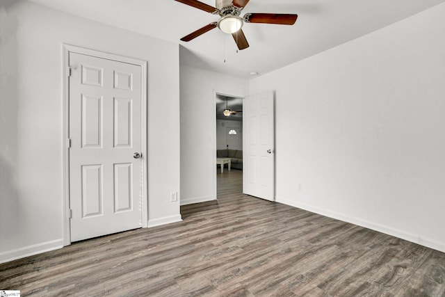 232 Ashley Danielle Dr, Duncan, SC 29334 - unfurnished bedroom featuring baseboards, ceiling fan, and wood finished floors