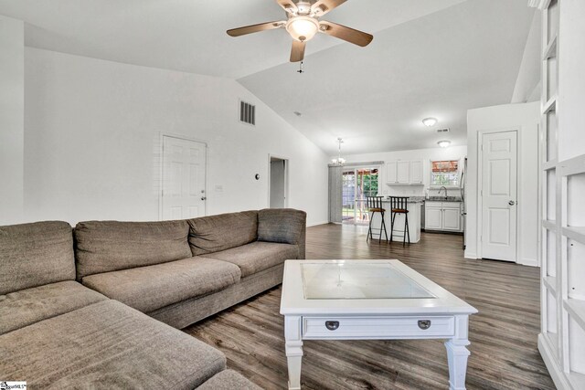 232 Ashley Danielle Dr, Duncan, SC 29334 - living area with visible vents, lofted ceiling, ceiling fan with notable chandelier, and dark wood-type flooring