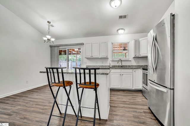 232 Ashley Danielle Dr, Duncan, SC 29334 - kitchen with a center island, white cabinetry, appliances with stainless steel finishes, and a kitchen breakfast bar